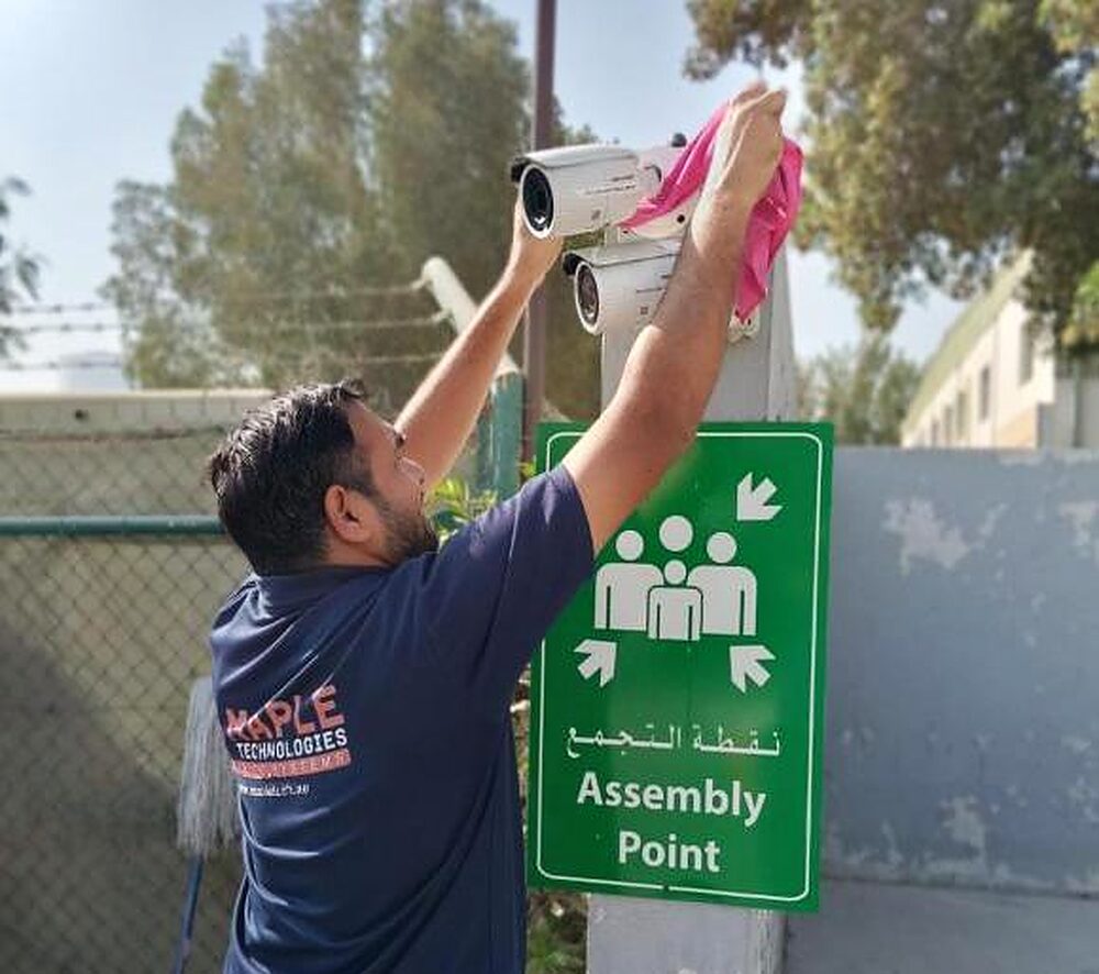 A camera being serviced on an industrial site in Dubai