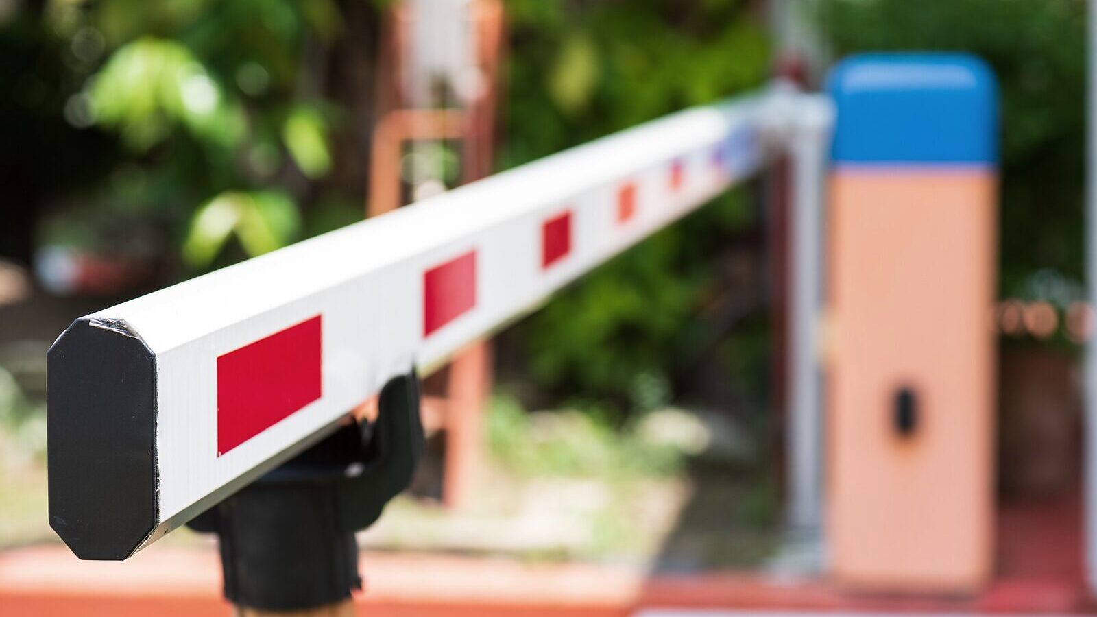 A road barrier arm at the entrance to a property