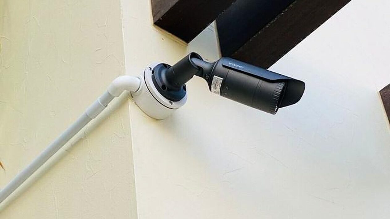 A camera mounted under the eave of a building in Dubai