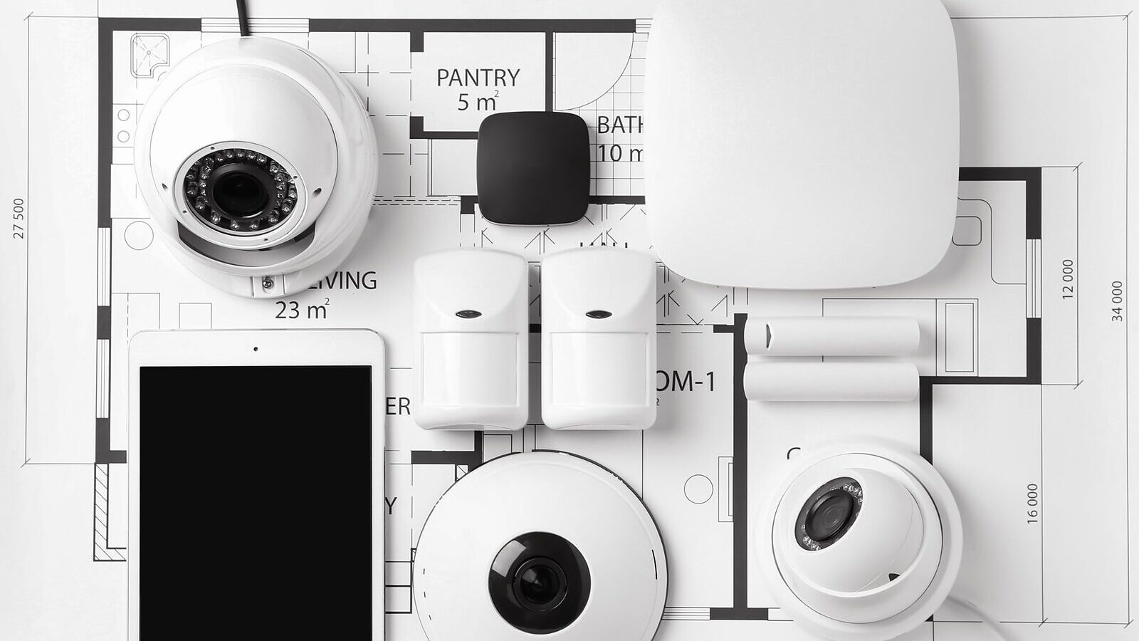 Cameras, a control panel, sensors and a tablet laid out on a floor plan