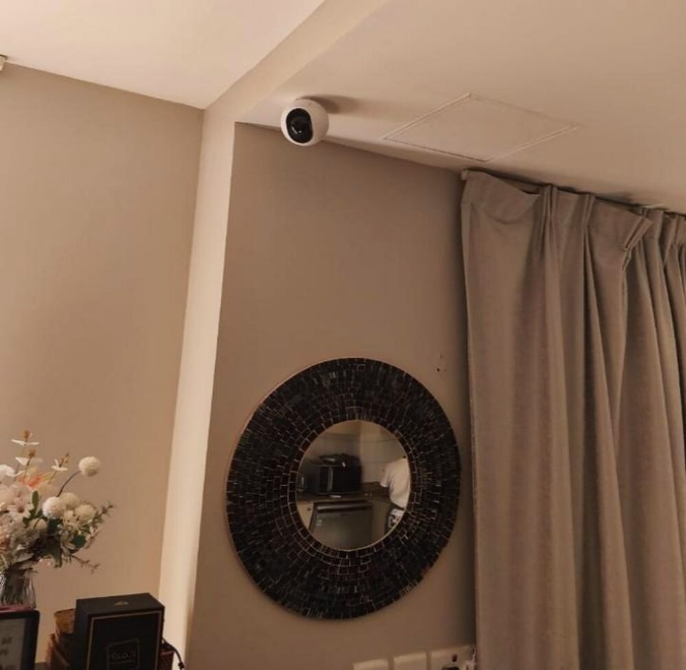 A discreet ceiling camera covering a showroom interior